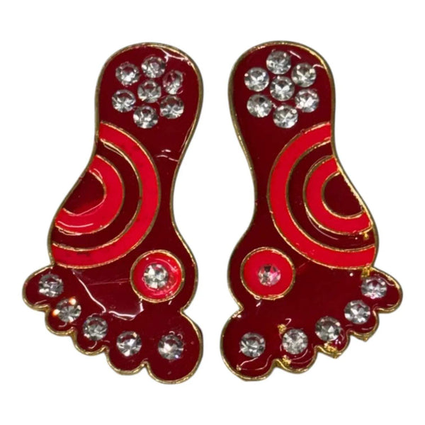 Two Krishna charan toys side-by-side, red and gold with rhinestone details
