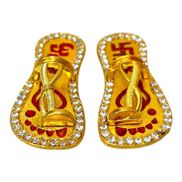 Miniature gold chappal slippers with glittery border and red decorative motifs
