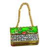 Miniature jeweled purse with green enamel top, red gem center, gold chain handle.