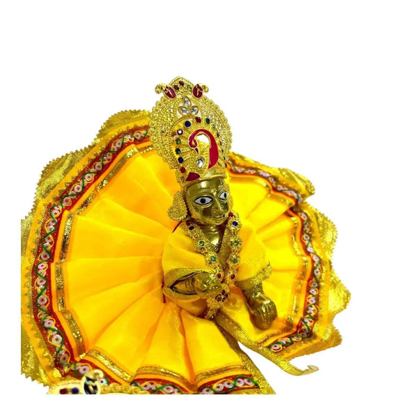 Gold jeweled headpiece and necklace worn on a decorated figure with red and blue stones