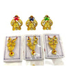 Gold-tone crown set with red, blue, and green enamel and jeweled designs on cards