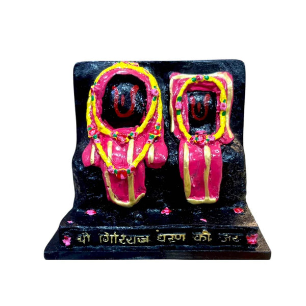 Marble dust idol statue with two seated figures in pink and gold on dark base