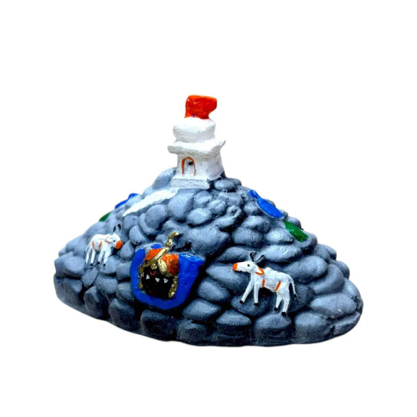 Blue-gray Govardhan hill idol with orange finial, white lingam, and colorful central emblem