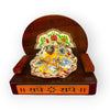 Wooden devotional throne holding a decorated Krishna idol on the front base