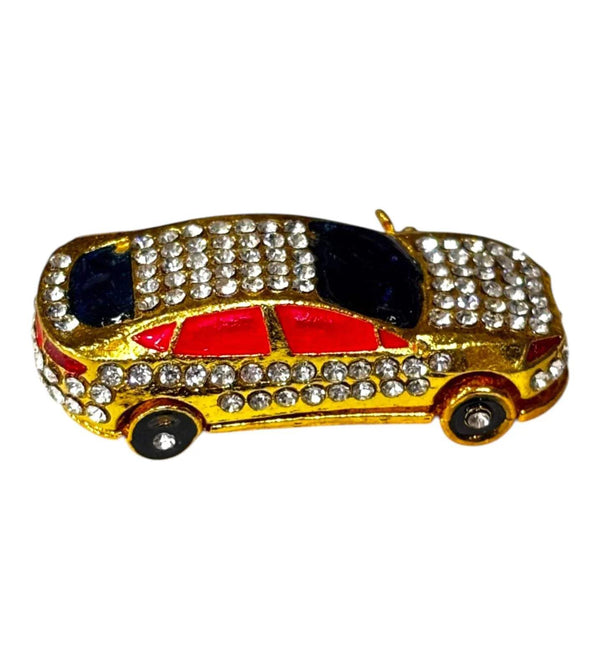Miniature decorative toy car front view with red stripe, dark window panels, gold rhinestones