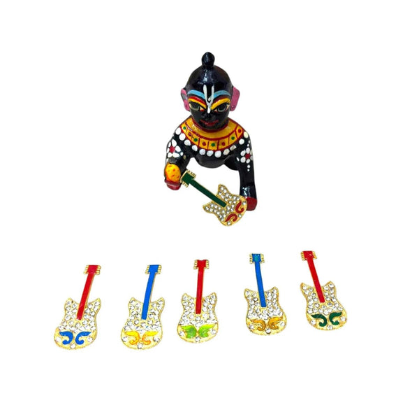 Krishna figurine holding miniature guitar; five colorful guitar ornaments displayed
