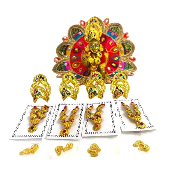 Deity ornament with multicolor fan backdrop and small gold jewelry pieces on cards