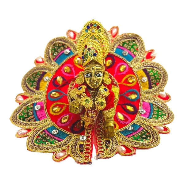 Multicolor jeweled deity ornament with gold face, red and blue fan headdress