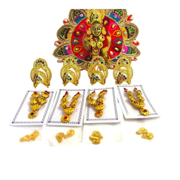 Deity ornament with colorful fan backdrop and small gold jewelry pieces on cards