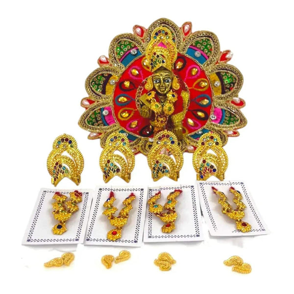 Gold-toned deity ornament with multicolor fan backdrop and small jewelry on cards
