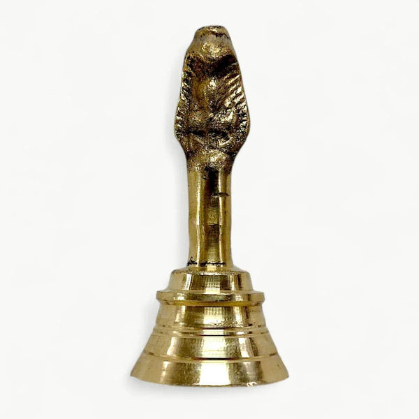 Gold brass garuda ghanti bell, close-up of flared base and detailed topper