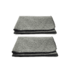 Stacked grey woolen puja asan mats with dark stitched border