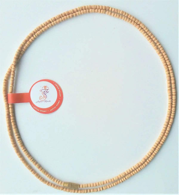 Tan bead mala necklace featuring a red ribbon with circular label