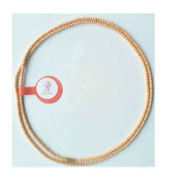 Tan small-bead mala necklace with red circular tag and ribbon