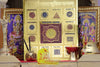 Framed gold-colored yantra poster with central mandala and surrounding circular symbols.