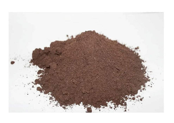Dhoop powder, dark brown mound of fine grains