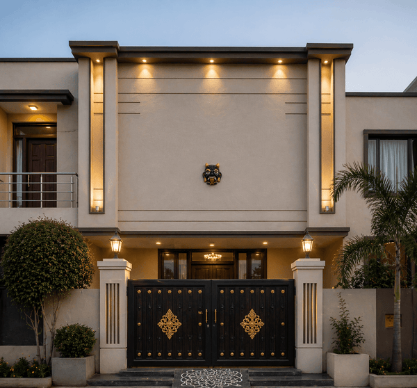Bhoot face mask wall hanging centered on entrance wall above gate