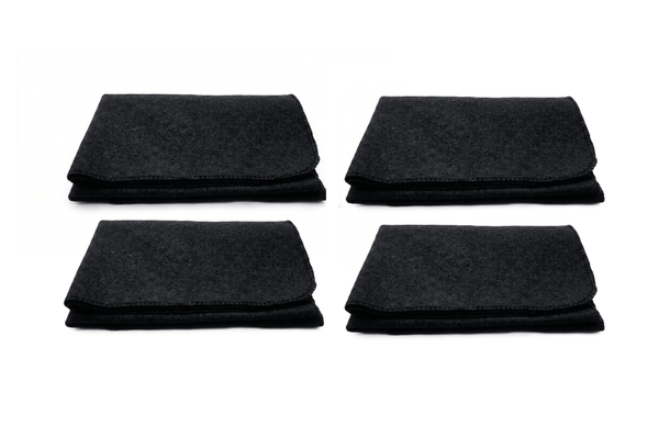 Set of four black woolen meditation mats, neatly stacked with stitched edges