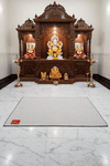 Light beige woolen meditation mat laid on the floor in a prayer area