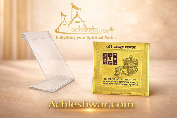 Gold yantra card on clear display stand with lunar chakra grid and seated deity