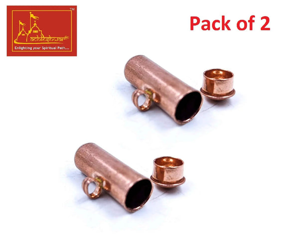 Copper capsule pendant pair with cylindrical copper tube, dark interior, and loop ends