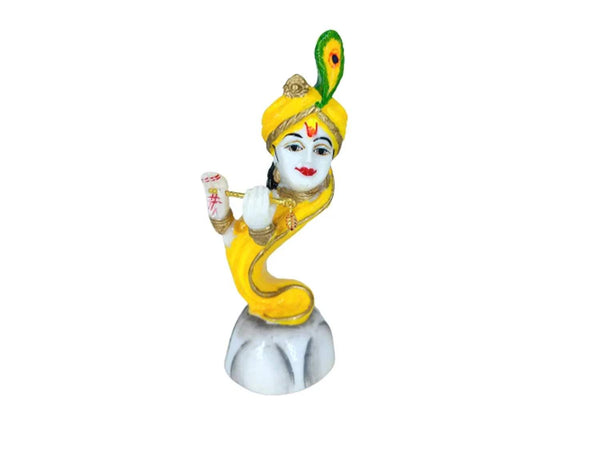 Lord Krishna marble idol with flute, yellow outfit, peacock feather headpiece, seated pose