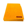 Yellow wool meditation mat with stitched border and brand label on corner