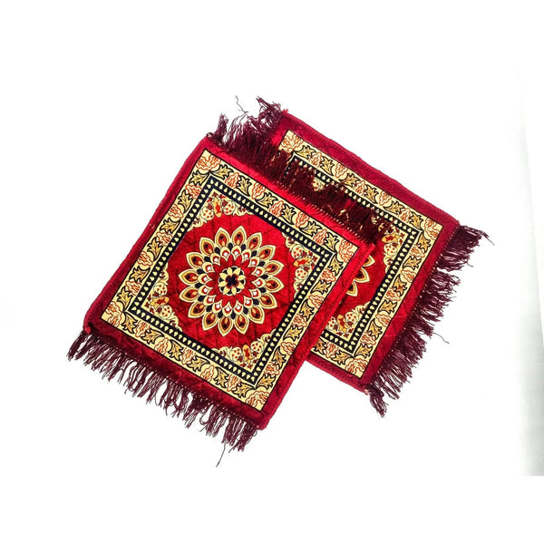 Pair of velvet pooja mats in burgundy and gold with framed mandala, tassel fringe