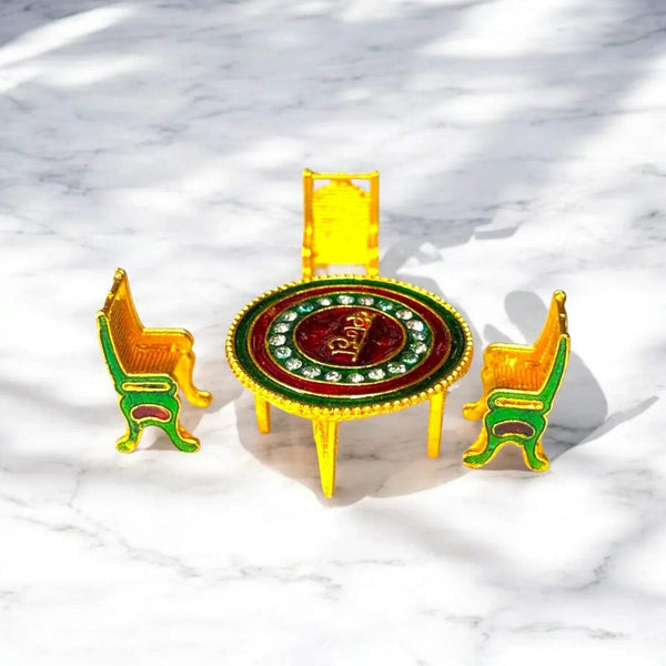 Toy dining table and four small chairs with round red center tabletop