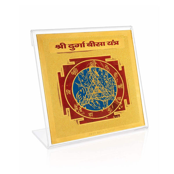Gold-toned yantra card in clear acrylic stand, close-up angled view