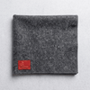 Rectangular grey woolen puja asan mat with dark stitched edge and label