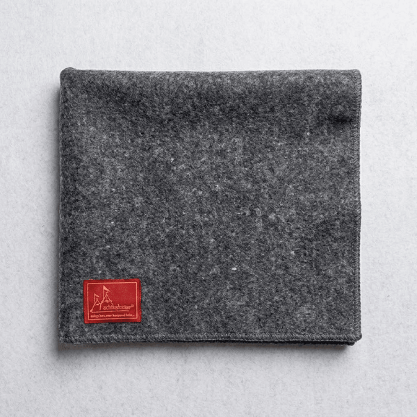 Rectangular grey woolen puja asan mat with dark stitched edge and label