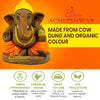 Eco-friendly Ganesha idol with yellow crown, orange dhoti, gray skin, and painted ornaments