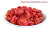 Javitri mace arils in a white dish, red-orange curled pieces