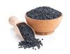 Black sesame seeds in wooden bowl and wooden scoop