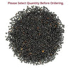 Heap of black mustard seeds with mixed small grains
