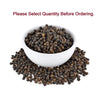 Black peppercorns in white bowl