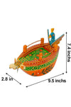Colorful painted wooden boat size 9.5 in x 2.8 in x 7.4 in, orange hull with green and red art