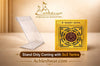 Mahamritunjaya yantra card in clear angled display stand, gold and black design