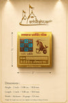 Gold-plated yantra card with a dimension diagram showing 2-inch size
