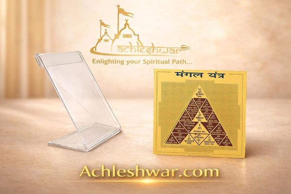 Golden triangular yantra card with plastic display stand on tabletop