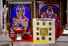 Gold and black Nav Durga yantra card with Devanagari text and central circular symbol