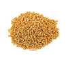 Large mound of mustard seeds with yellow round grains