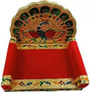 Peacock design wooden throne with gold trim and red fabric seat