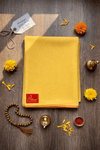 Yellow wool meditation mat with orange-red border and corner label