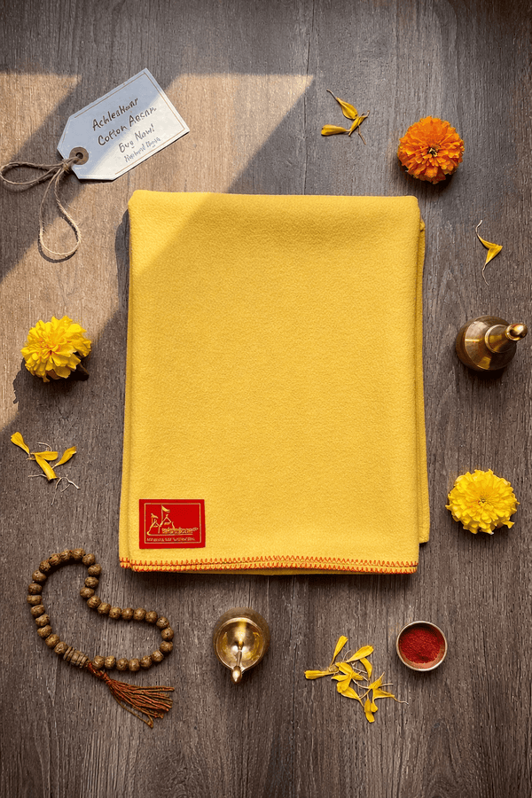 Yellow wool meditation mat with orange-red border and corner label