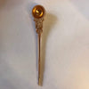 Copper ritual spoon with round ornate cup and long handle