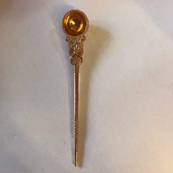 Copper ritual spoon with round ornate cup and long handle