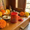 Kumkum sindur powder jar with open lid, showing red powder inside