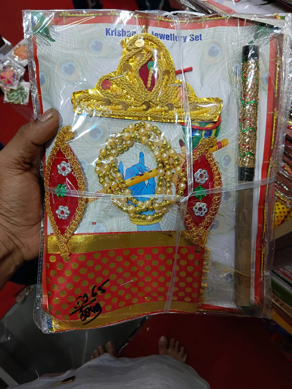 Baccha set in plastic wrap, red and gold decorative fabric pieces with white backing